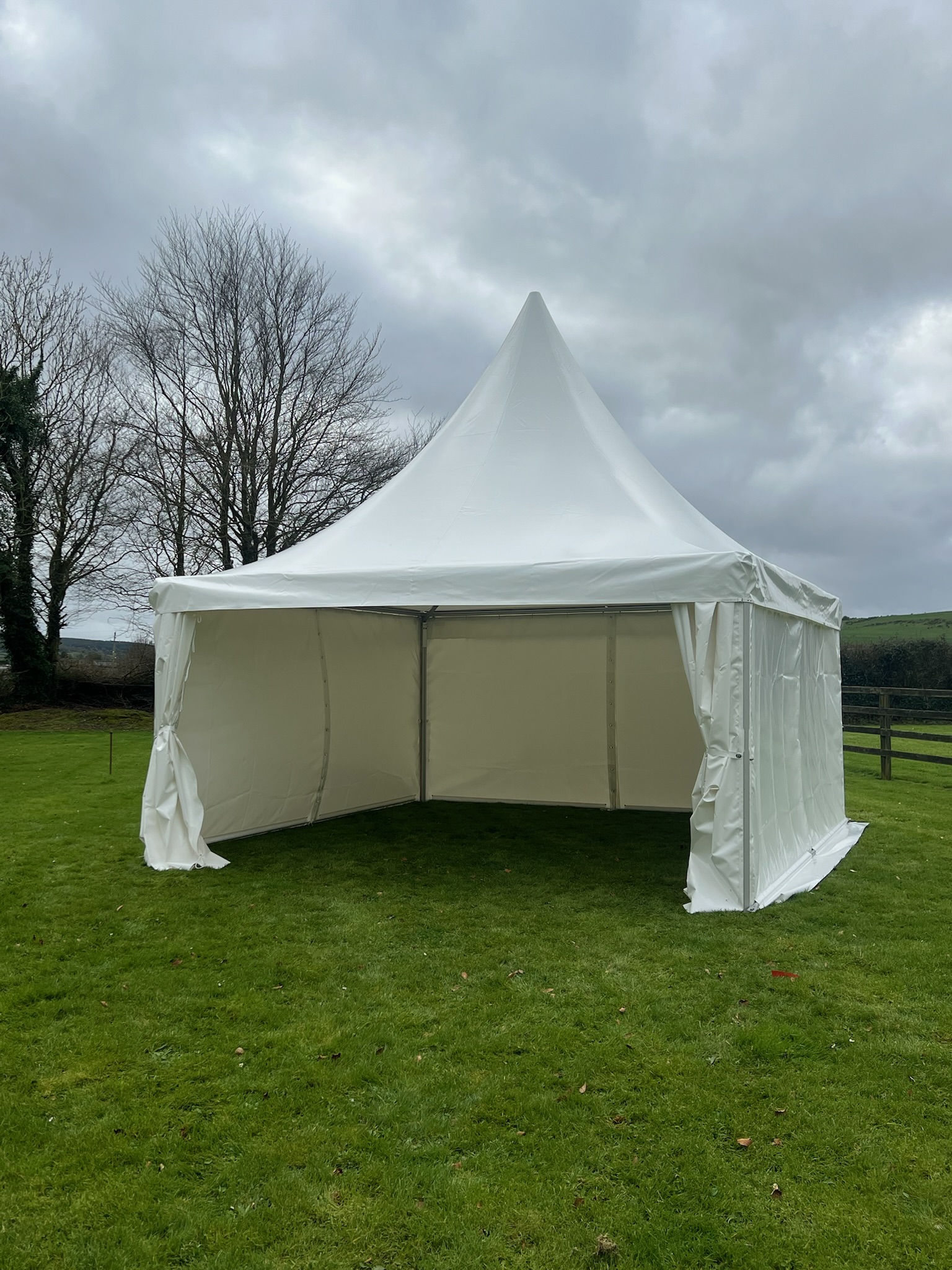 Marquee with hardwood flooring and lighting